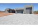 Modern home with a three-car garage, block driveway, and sleek architectural design at 1250 E Smokehouse Trl, Phoenix, AZ 85085