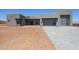 Stunning modern home with gray stucco and a three-car garage, and a paved driveway at 1250 E Smokehouse Trl, Phoenix, AZ 85085