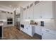 Bright kitchen showcases white cabinets, stainless steel appliances, and pristine countertops at 1250 E Smokehouse Trl, Phoenix, AZ 85085