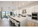 Contemporary kitchen with oversized island, stainless steel appliances, and pendant lighting at 1250 E Smokehouse Trl, Phoenix, AZ 85085