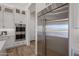 Modern kitchen featuring stainless steel appliances and white cabinetry at 1250 E Smokehouse Trl, Phoenix, AZ 85085