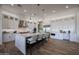 Gourmet kitchen with a large center island, stainless steel appliances, and custom white cabinetry at 1250 E Smokehouse Trl, Phoenix, AZ 85085