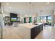 Open-concept kitchen with stainless steel appliances, quartz countertops, and a view to the living room with fireplace at 1250 E Smokehouse Trl, Phoenix, AZ 85085