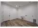 Utility room featuring tile floors, a sink, a washer and dryer hookups, and a door at 1250 E Smokehouse Trl, Phoenix, AZ 85085