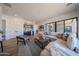 Bright living room with neutral décor, modern bar area, and large sliding doors for seamless indoor/outdoor living at 1250 E Smokehouse Trl, Phoenix, AZ 85085