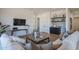 Bright living room featuring modern decor, hardwood floors, a comfortable sofa, and views at 1250 E Smokehouse Trl, Phoenix, AZ 85085