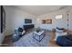 Bright living room featuring modern furniture, stylish decor, and ample natural light, creating a cozy atmosphere at 1250 E Smokehouse Trl, Phoenix, AZ 85085