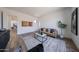 Well-lit living room showcasing a modern design with comfortable seating, elegant decor, and an open layout at 1250 E Smokehouse Trl, Phoenix, AZ 85085