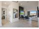 Open-concept living room with a fireplace, tile flooring, and stylish decor at 1250 E Smokehouse Trl, Phoenix, AZ 85085