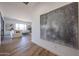Open concept living area with modern decor, wood floors, a comfortable sofa, and views of the landscape at 1250 E Smokehouse Trl, Phoenix, AZ 85085
