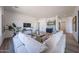 Bright living room featuring modern decor, hardwood floors, a comfortable sofa, and views at 1250 E Smokehouse Trl, Phoenix, AZ 85085