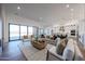 Open concept living room with a modern fireplace and seamless flow to the gourmet kitchen at 1250 E Smokehouse Trl, Phoenix, AZ 85085