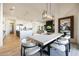 A full view of the open concept kitchen, dining, and living areas, offering an inviting and spacious layout at 1250 E Smokehouse Trl, Phoenix, AZ 85085