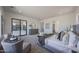 Bright main bedroom with a sitting area, ensuite bath, and access to outdoor patio space at 1250 E Smokehouse Trl, Phoenix, AZ 85085