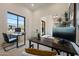 Bright office space with two desks, modern black-framed windows, and stylish decor, perfect for working from home at 1250 E Smokehouse Trl, Phoenix, AZ 85085
