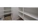 Walk-in pantry with ample shelving providing plenty of storage space, and tile floors at 1250 E Smokehouse Trl, Phoenix, AZ 85085