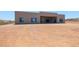 Modern home showcasing large windows with black frames, desert landscaping, and a seamless blend with the natural surroundings at 1250 E Smokehouse Trl, Phoenix, AZ 85085