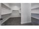 Spacious walk-in closet with custom shelving and ample storage space at 1250 E Smokehouse Trl, Phoenix, AZ 85085