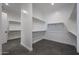 Spacious walk-in closet with custom shelving and ample storage space at 1250 E Smokehouse Trl, Phoenix, AZ 85085