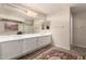 Well-lit bathroom with double sinks, a large mirror, and plenty of counter space at 13313 W Palo Verde Dr, Litchfield Park, AZ 85340