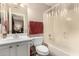 Bathroom featuring a white vanity, toilet, and shower/tub combination at 13313 W Palo Verde Dr, Litchfield Park, AZ 85340