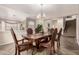 Formal dining room featuring wood floors and a wooden table with seating for six at 13313 W Palo Verde Dr, Litchfield Park, AZ 85340