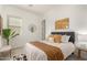 Bright bedroom featuring large windows, and modern decor at 13618 W Phacelia Ln, Peoria, AZ 85383
