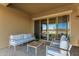 Stylish covered patio featuring a seating area, perfect for enjoying the outdoors in comfort and shade at 13618 W Phacelia Ln, Peoria, AZ 85383