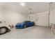 Three car garage with epoxy floors and overhead door at 13618 W Phacelia Ln, Peoria, AZ 85383