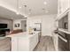 Kitchen area offers stainless appliances, tile floors, and seamless flow to the living area at 13618 W Phacelia Ln, Peoria, AZ 85383