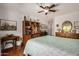Bedroom featuring a ceiling fan, and a built-in bookcase and wooden dresser at 1474 E Riviera Dr, Chandler, AZ 85249