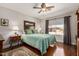 Primary bedroom featuring a ceiling fan, decorative rug, and a large window at 1474 E Riviera Dr, Chandler, AZ 85249