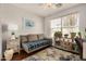 Cozy room with a daybed, natural light, ceiling fan and a stylish decorative rug at 1474 E Riviera Dr, Chandler, AZ 85249