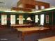 Elegant billiard room featuring multiple pool tables and cozy seating areas at 1474 E Riviera Dr, Chandler, AZ 85249