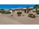 Manicured exterior with well-kept lawn and a two-car garage at 1474 E Riviera Dr, Chandler, AZ 85249