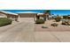 Well maintained home featuring a two car garage and desert landscaping at 1474 E Riviera Dr, Chandler, AZ 85249