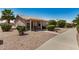 Charming exterior with covered patio, desert landscaping, and a well-maintained walkway at 1474 E Riviera Dr, Chandler, AZ 85249