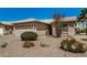 Single-story home with desert landscaping, barrel cactus and a spacious two-car garage at 1474 E Riviera Dr, Chandler, AZ 85249
