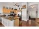 Bright kitchen with stainless appliances, and wood cabinets; entry door adjacent at 1474 E Riviera Dr, Chandler, AZ 85249