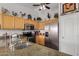 Bright kitchen with stainless appliances, and wood cabinets at 1474 E Riviera Dr, Chandler, AZ 85249