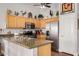 Bright kitchen with stainless appliances, and wood cabinets at 1474 E Riviera Dr, Chandler, AZ 85249