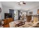 Open-concept living space featuring hardwood floors and seamless flow to dining area at 1474 E Riviera Dr, Chandler, AZ 85249