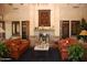 Cozy living room featuring a fireplace, bookshelves and couches, decorated with Christmas at 1474 E Riviera Dr, Chandler, AZ 85249