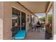 Covered patio with patio furniture, a sliding glass door, and a view of the backyard at 1474 E Riviera Dr, Chandler, AZ 85249