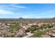 Beautiful desert community with scenic views, lush landscaping, and tile roof homes on an expansive sunny day at 15025 E Scarlet Sky Ln # 1, Fountain Hills, AZ 85268
