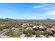 Aerial view of the community and home featuring desert landscaping, neutral colors, and mountain views at 15025 E Scarlet Sky Ln # 1, Fountain Hills, AZ 85268
