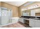Bathroom featuring a large shower, garden tub, and dual sinks at 15025 E Scarlet Sky Ln # 1, Fountain Hills, AZ 85268