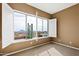 Bedroom with large shuttered window, cactus, and views at 15025 E Scarlet Sky Ln # 1, Fountain Hills, AZ 85268
