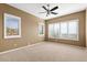 Bedroom with carpet, ceiling fan, and shuttered windows with views at 15025 E Scarlet Sky Ln # 1, Fountain Hills, AZ 85268