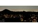 Night shot of desert community, illuminated by city lights and mountain silhouettes at 15025 E Scarlet Sky Ln # 1, Fountain Hills, AZ 85268